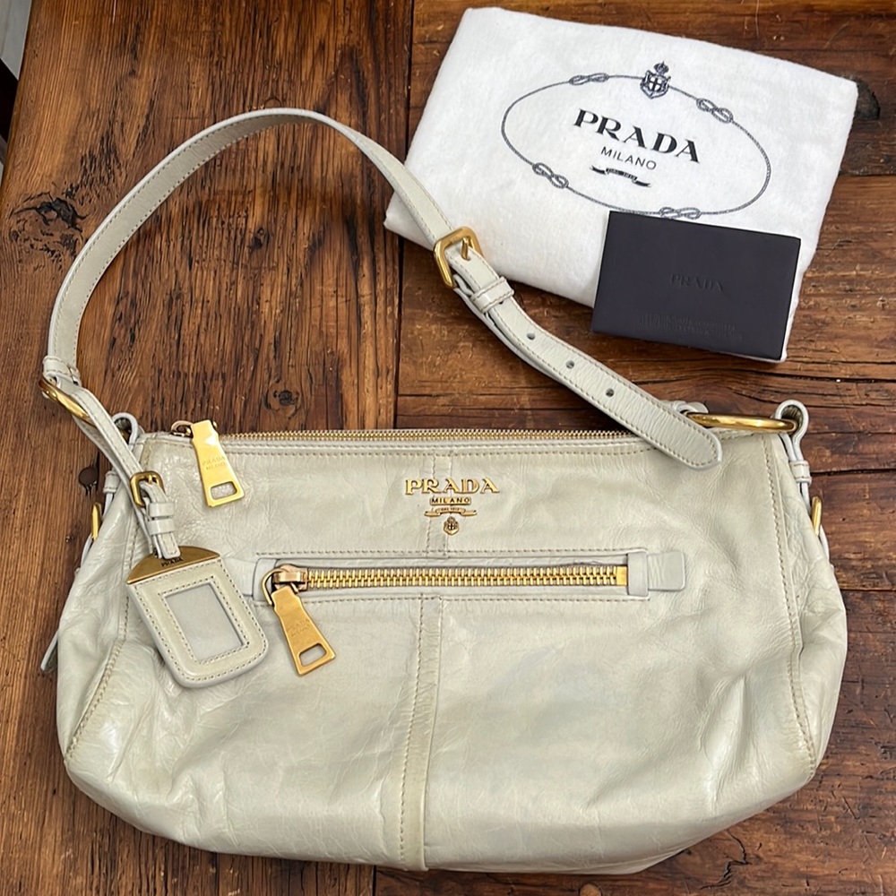 Prada Bone White Shoulder Bag with top stitching and gold color hardware.